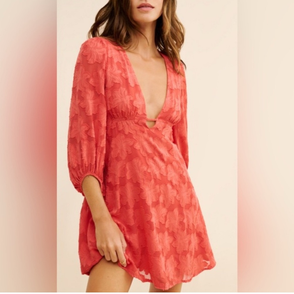 Anthropologie jacquard plunge floral flounce dress with bishop sleeves.